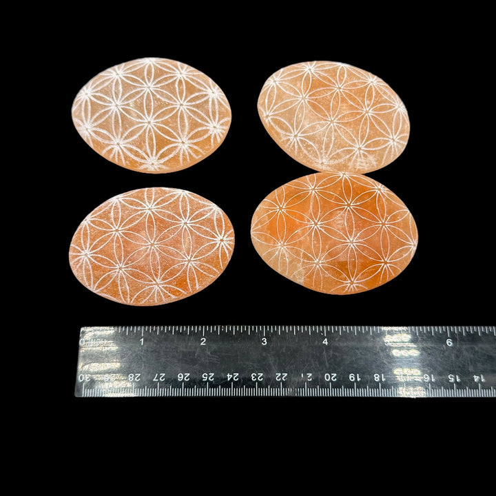 Peach Selenite Engraved Palmstone - Flower Of Life